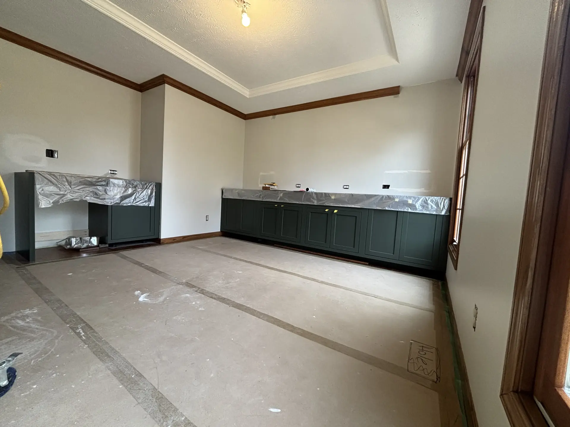 Dark green cabinets installed